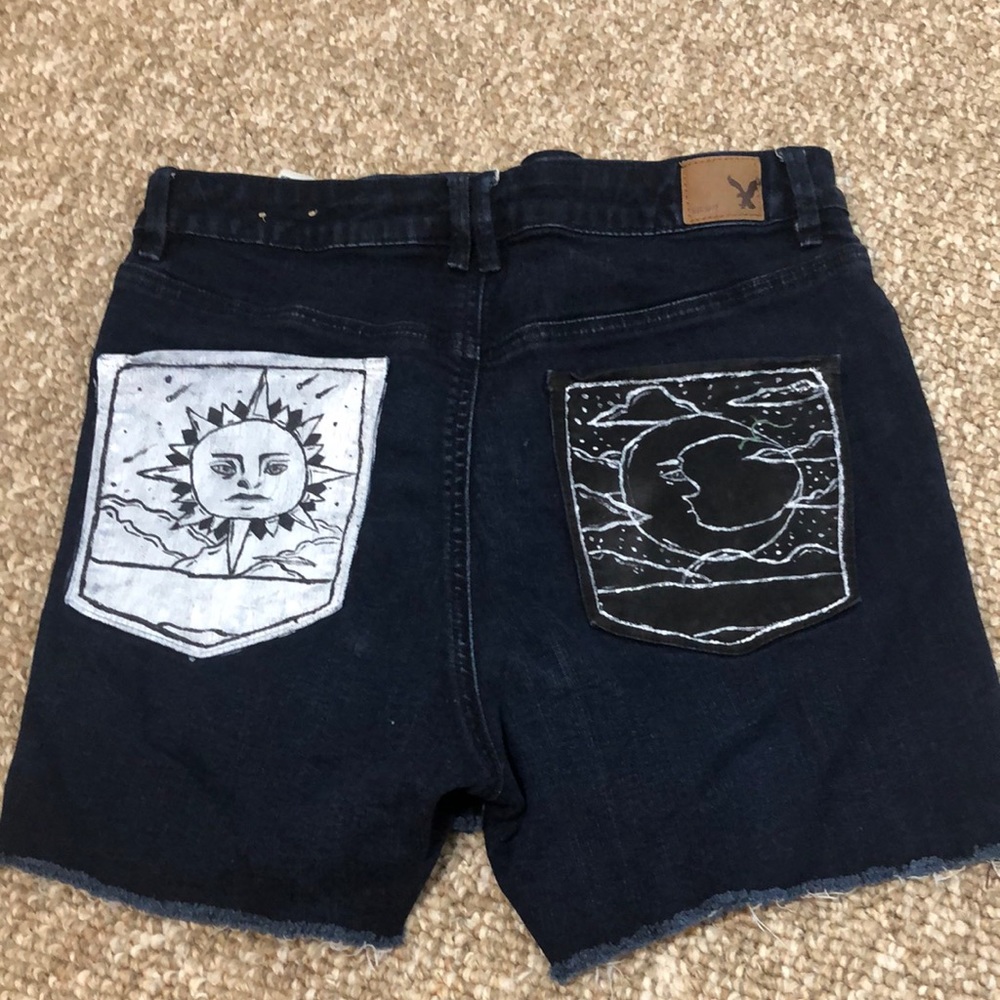 Custom sun/moon painted cut off jean shorts